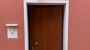 A door with a white frame and a small window above it.
