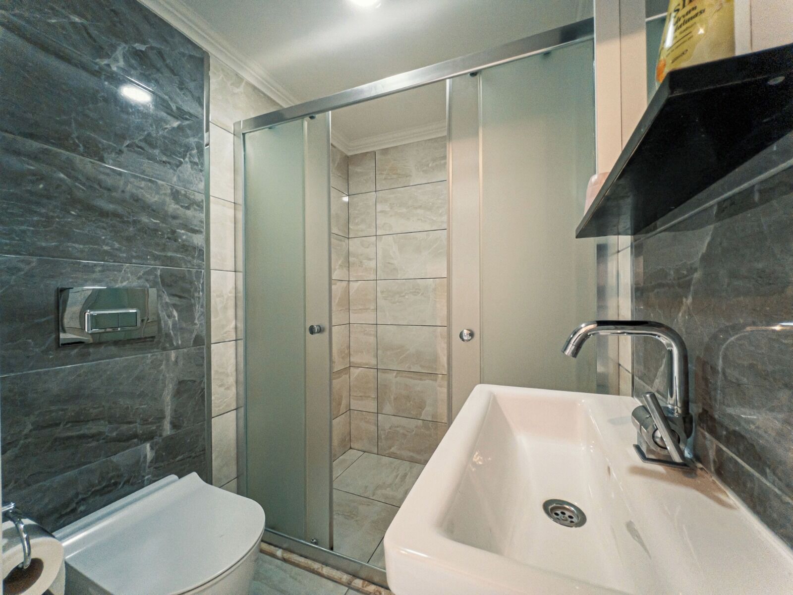 Shower, hair dryer, towels, toilet paper