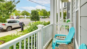 A porch with a white railing, a mailbox, and two turquoise chairs. - Walk to Ocean: Group Getaway in Virginia Beach! (Virginia Beach)