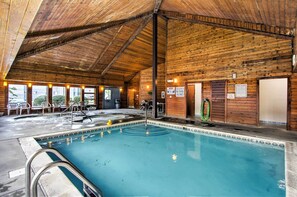 An indoor swimming pool with a wooden ceiling and walls, surrounded by lounge chairs and a hot tub. - 2 Mi to Ober Mountain: Cozy Retreat w/ Balcony (Gatlinburg)