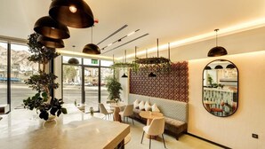 A modern interior with a bar area, seating, and a decorative wall.