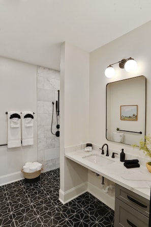 Shower, hair dryer, towels, shampoo