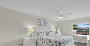 A bedroom with a bed, nightstands, a desk, and a window. - E-234 & F- 237 - Perfect for Group Travel (Naples)