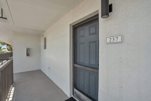 A white exterior wall with a grey door and a number plate '237'. - E-234 & F- 237 - Perfect for Group Travel (Naples)