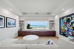  This is the Family/TV Room which, with its pullout Queen Sofa, can be used as a 3rd, bedroom: en-suite with oversized bath/Jacuzzi; & Massage Chair.
