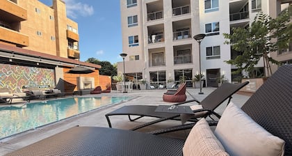 Modern Hollywood 1BR • Expansive Balcony with Pool Views & Resort Amenities