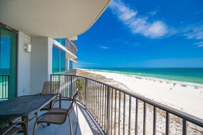 A balcony with a view of a beach and ocean. - Phoenix Ix 505 3 Bedroom Condo (Orange Beach)
