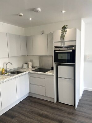 Fridge, microwave, toaster, cookware/dishes/utensils
