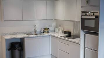 Fridge, microwave, toaster, cookware/dishes/utensils