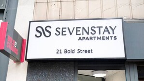 A sign for SS SEVENSTAY APARTMENTS at 21 Bold Street.