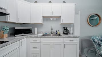 Fridge, microwave, coffee/tea maker, toaster