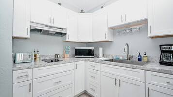 Fridge, microwave, coffee/tea maker, toaster
