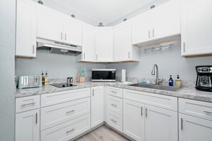 Fridge, microwave, coffee/tea maker, toaster