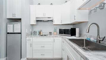 Fridge, microwave, coffee/tea maker, toaster