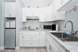 Fridge, microwave, coffee/tea maker, toaster - Beachfront Condo 123 in Downtown Cedar Key (Cedar Key)