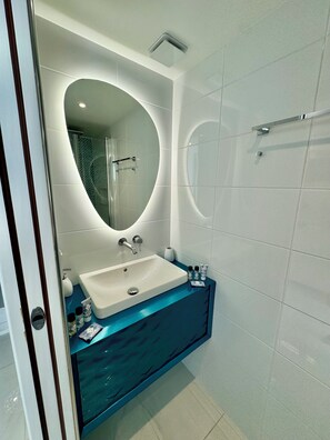 Shower, hair dryer, towels, toilet paper