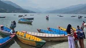 A lake with boats and people. - Hotel Mountain Village (Pokhara)