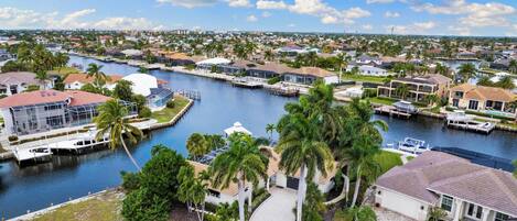 A residential area with houses, a marina, and a waterway.