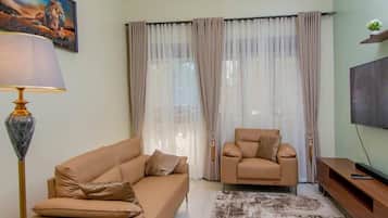 Townhome | Living area | 55-inch LED TV with digital channels, Netflix, pay films