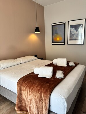 1 bedroom, desk, iron/ironing board, travel crib