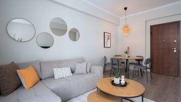 Superior Apartment, 2 Bedrooms, Balcony, City View | Living area | 50-inch TV with cable channels