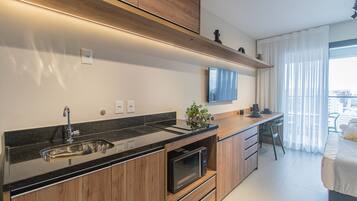 Fridge, microwave, stovetop, coffee/tea maker
