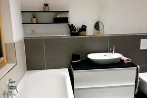 Shower, towels, soap, toilet paper