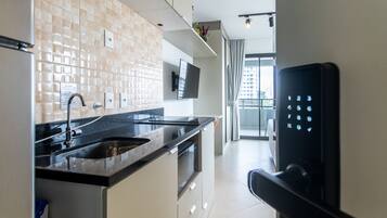 Fridge, microwave, stovetop, coffee/tea maker