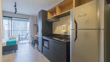 Fridge, microwave, stovetop, coffee/tea maker