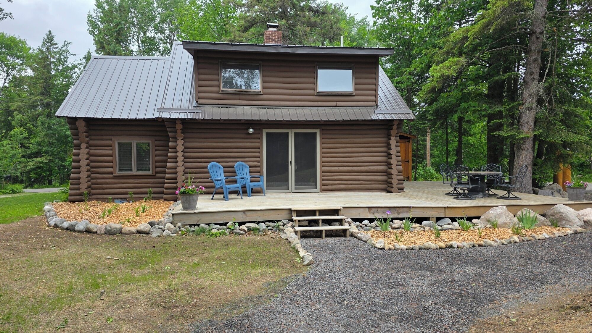 Large deck with flower gardens.  Great spot to enjoy your morning coffee.