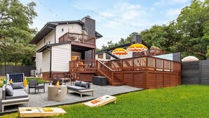 A backyard with a deck, outdoor seating, and a fire pit. - Pool, Firepit, Mins to DT, SXSW, ACL, Sleeps 6 (Austin)