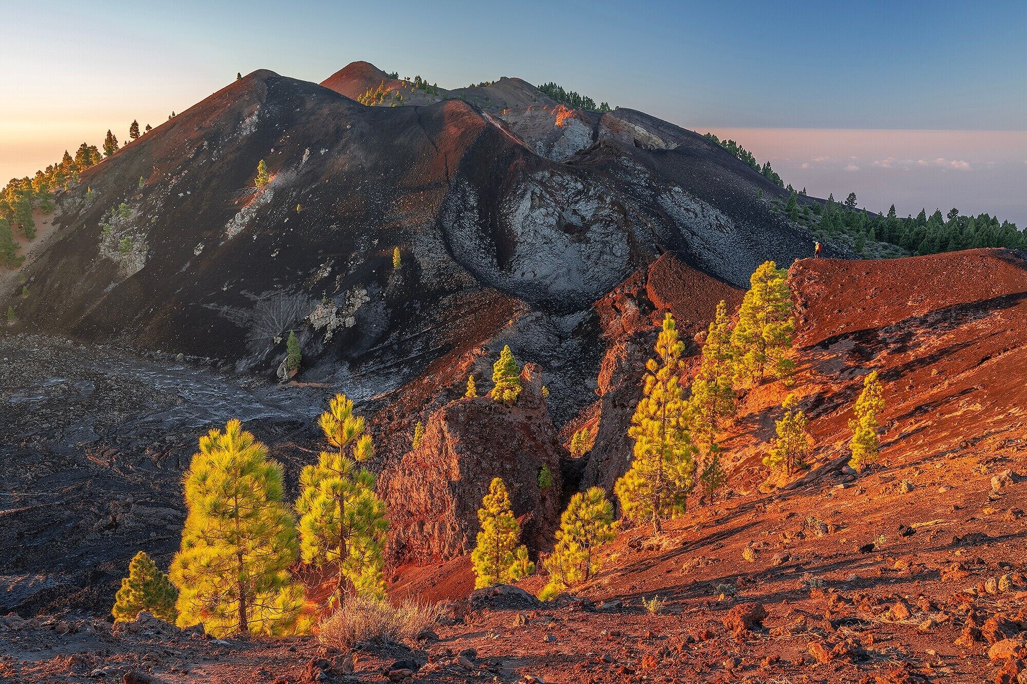 A mountainous landscape with rocky terrain and sparse vegetation.
