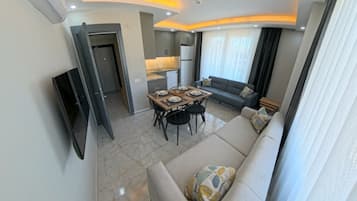 Apartamento exclusivo, cozinha | Berços grátis, Wi-Fi de cortesia, roupa de cama