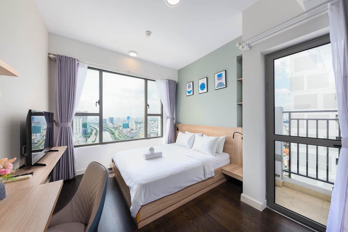 Deluxe Apartment, 3 Bedrooms, Balcony, River View | Minibar, desk, laptop workspace, blackout drapes