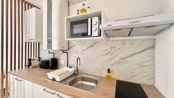 Fridge, microwave, stovetop, coffee/tea maker