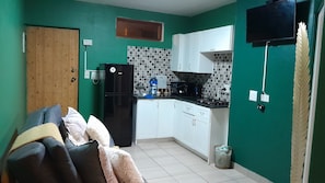 Microwave, stovetop, electric kettle, cookware/dishes/utensils
