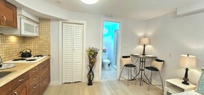 Fridge, microwave, stovetop, coffee/tea maker