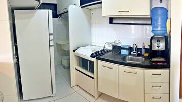 Fridge, microwave, blender, cookware/dishes/utensils