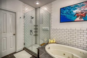 Shower, hair dryer, towels, shampoo