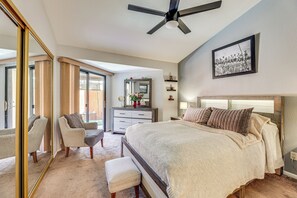 A bedroom with a large bed, a chair, a dresser, and a ceiling fan. - Mesa Haven w/ Patio, Heated Pool & Hot Tub Access (Mesa)