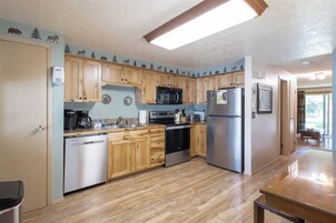 Townhome, Balcony | Private kitchen | Coffee/tea maker, electric kettle, highchair