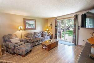 Townhome, Balcony | Living area | 65-inch Smart TV with digital channels, streaming services