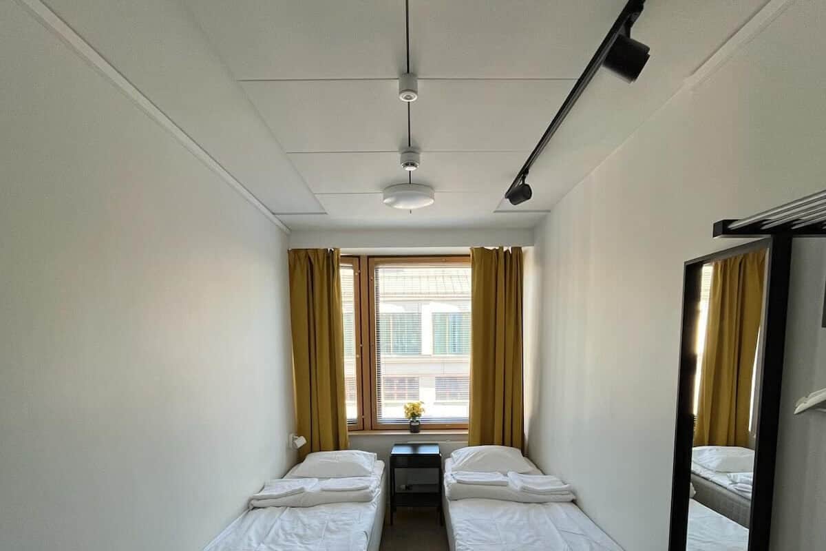 Premium bedding, desk, laptop workspace, blackout drapes