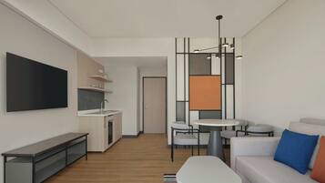 A modern living room with a sofa, a coffee table, a TV, and a kitchen area with a dining table and chairs.