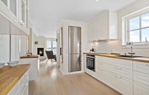 Fridge, stovetop, dishwasher, coffee/tea maker