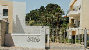 A gated entrance with a sign reading "Cascais Riviera."