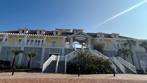 A large, multi-story building with a prominent staircase leading to the entrance.