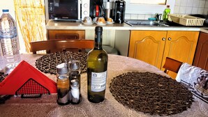 A kitchen with a microwave, coffee maker, and various kitchen items on the counter. -     Καλώς ήρθατε στη βάση των διακοπών σας. (Κόρινθ ος)