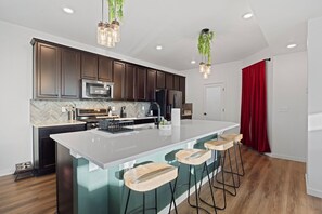 Fridge, toaster, blender, dining tables