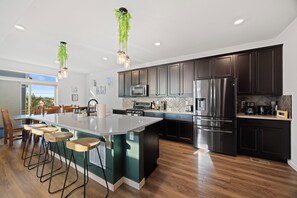 Fridge, toaster, blender, dining tables